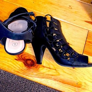 Black zip up open heel shoe